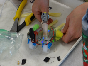 A student building a Junk Drawer Robot.
